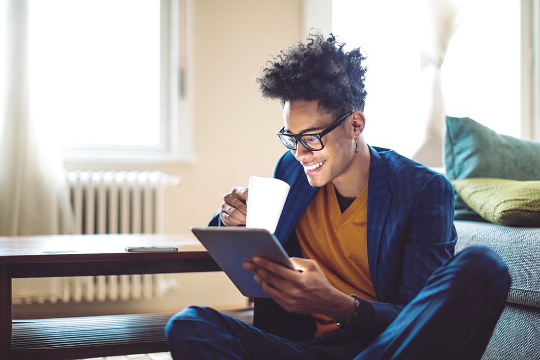 happy-person-reading-on-tablet